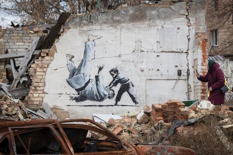 The media may have unmasked Banksy - again. That's angered some art fans but not ruffled dealers
