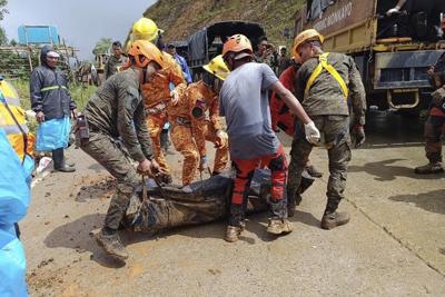 At least 7 people dead after a landslide buries a house in the southern Philippines, official says