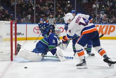 Quinn Hughes scores OT winner as Canucks claw out 4-3 win over Islanders