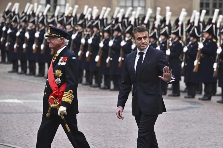 France's president gets a ceremonial welcome as he starts a 2-day state visit to Sweden