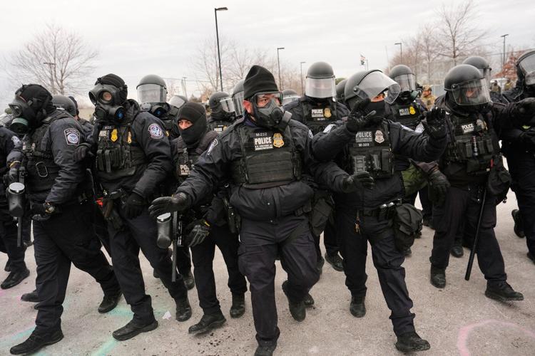 Photos of tensions between federal officers and locals in Minneapolis