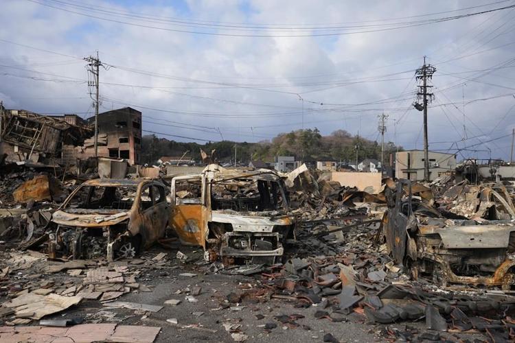 Survivors are found in homes smashed by Japan quake that killed 94 people. Dozens are still missing
