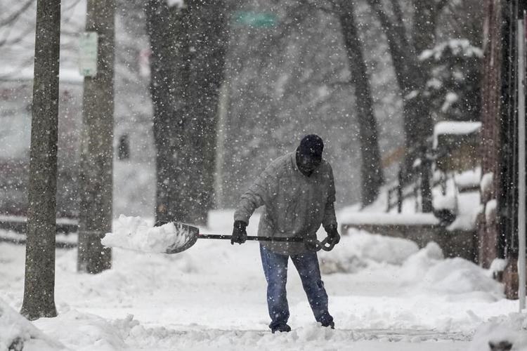 Winter storm with snow, ice, wind and bitter cold pummels much of the northern US