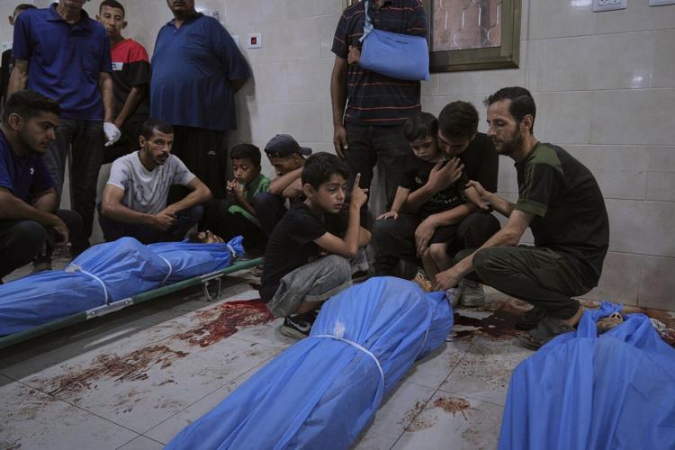 Photos show Palestinians mourning after people were killed in Israeli strikes