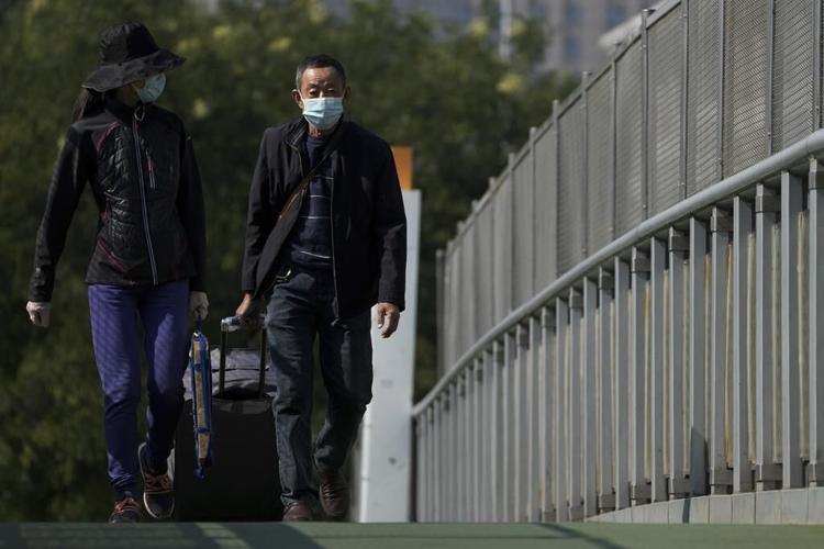 China's vast Xinjiang hit with COVID-19 travel restrictions