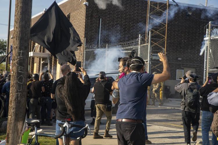 Protesters try to block vehicles at key immigration building in suburban Chicago