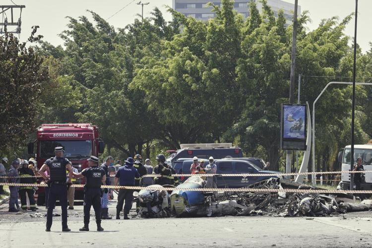 A small plane slams into a Brazilian street and kills 2 people on board