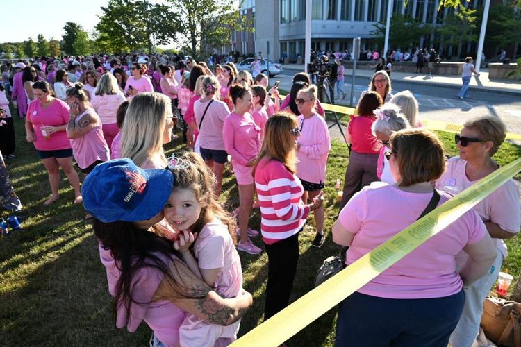 Women in pink rally in support of Lindsay Clancy who is on trial for killing 3 children