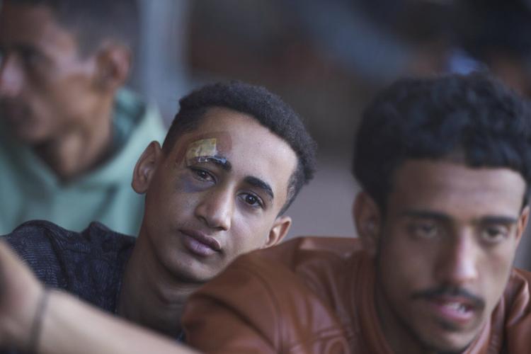 Photos show migrants intercepted near Crete arrive at the Greek port of Lavrio from Libya
