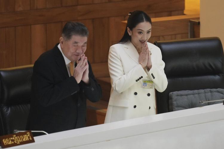 Thailand's prime minister faces a no-confidence vote over alleged influence by her father