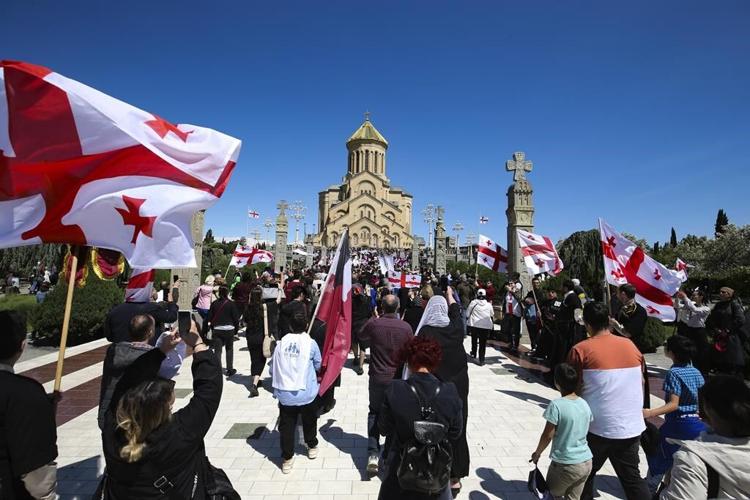 Georgia's prime minister joins tens of thousands in a march to promote 'family purity'