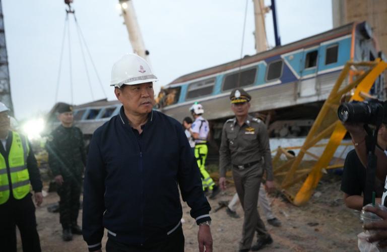 Photos show rescue workers at scene of crane collapse and train derailment in Thailand