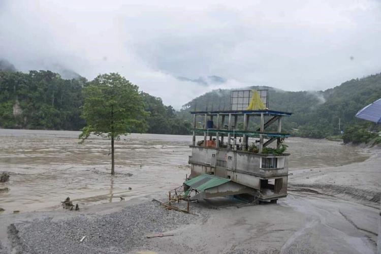 Icy floodwaters burst through major dam in India's northeast, killing at least 31 people