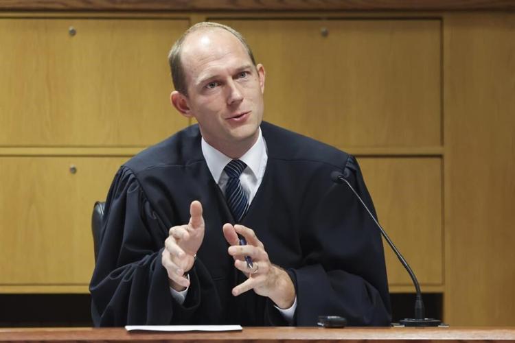 Trump won't be tried with Powell and Chesebro next month in Georgia election case, judge rules