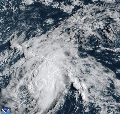 Tropical Storm Hone moves past Hawaii as two other cyclones stay active in the Pacific Ocean