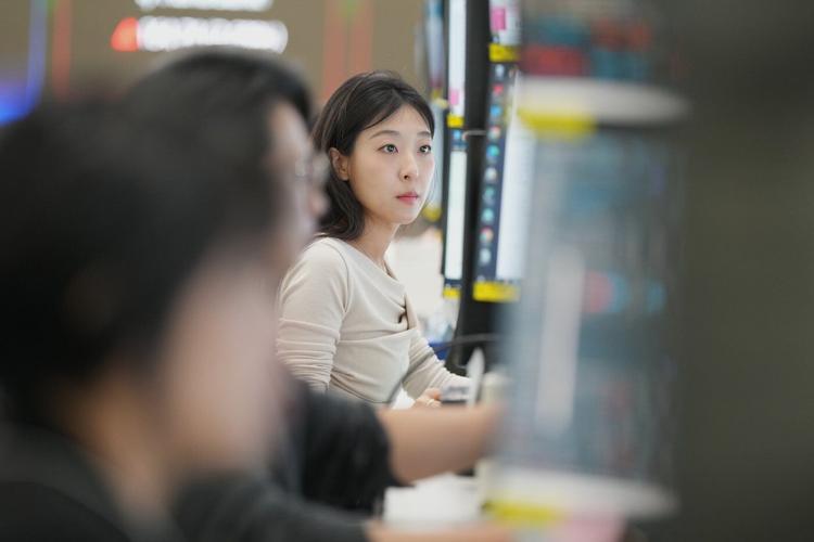 Asian markets are mixed and oil is steady after Wall Street hits records