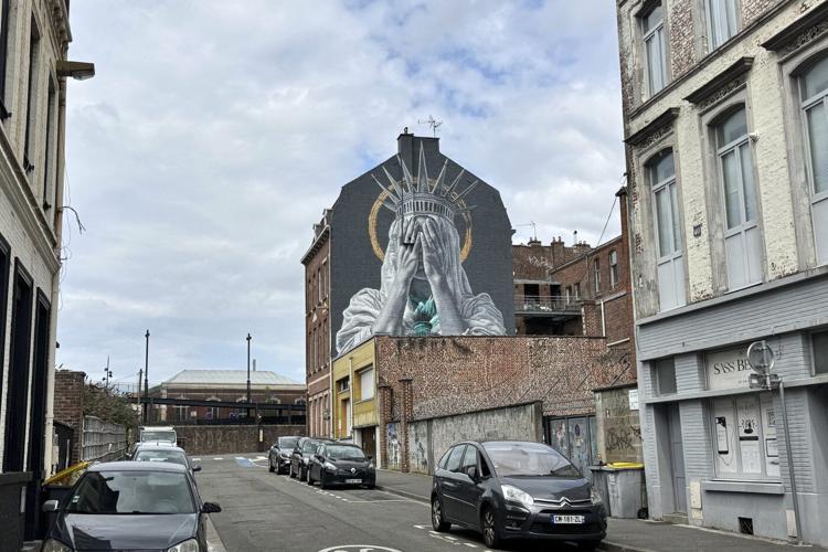 A new mural in France shows the Statue of Liberty covering her eyes in a swipe at Trump