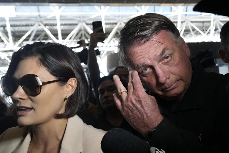 Banned from traveling, Brazil's Bolsonaro sees off his wife heading to Trump’s inauguration