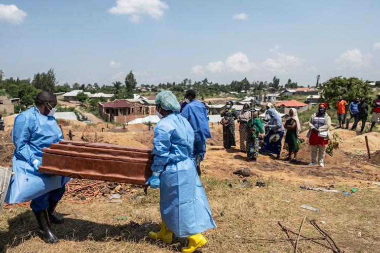 Mourners bury a 6-month-old Ebola victim, marking third orphanage death as Congo outbreak spreads