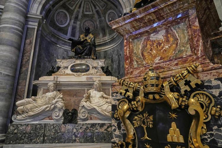 Pope makes another surprise appearance at St. Peter's, greeting restorers of papal tombs