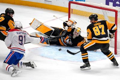 NHL roundup: Crosby makes history as Penguins edge Canadiens 4-3 in shootout