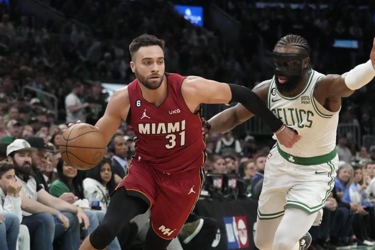 Butler scores 35, Heat rally to beat Celtics 123-116 in East finals opener