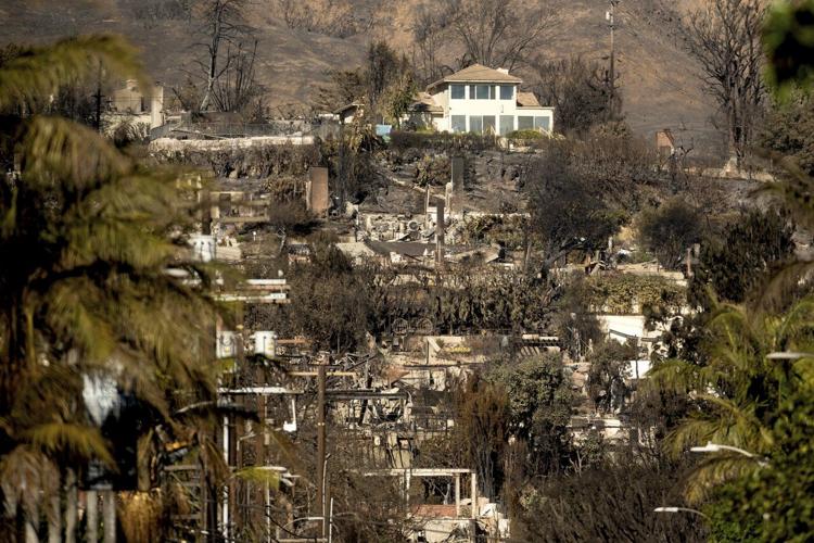 Why are lone homes left standing after the fires? It's not entirely luck