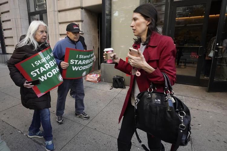 Thousands of Starbucks workers go on a one-day strike, one of busiest days of year for the chain