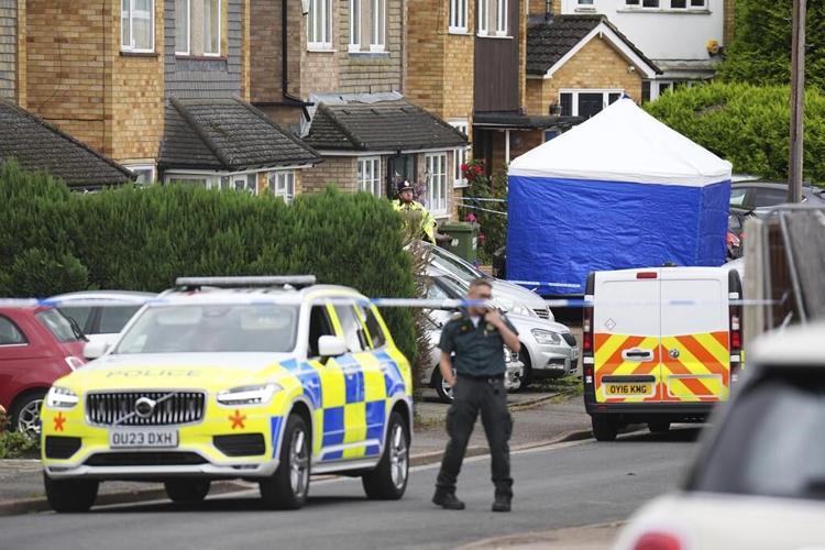 UK police are searching for a man with a crossbow after BBC radio commentator's family is killed