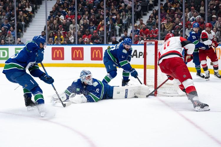 Beleaguered Vancouver Canucks show fight in loss to high-powered Carolina Hurricanes