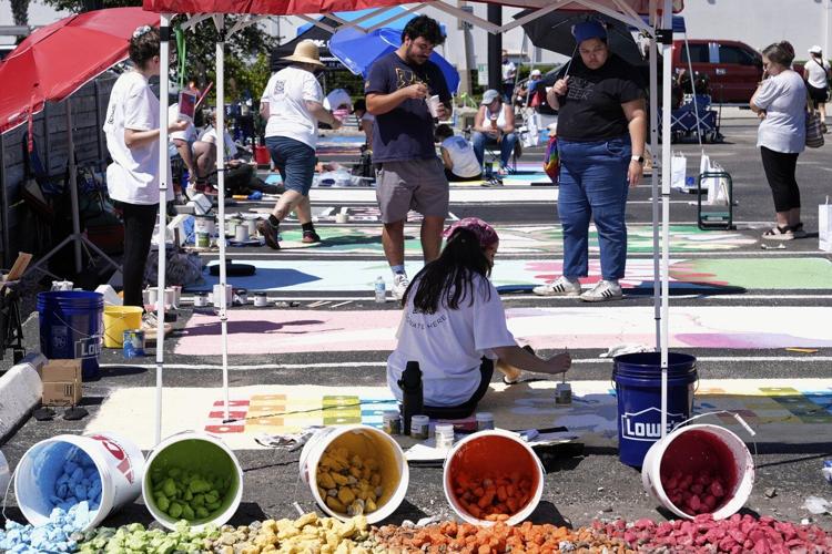 Parking spots used as colorful protest against Florida crackdown on rainbow crosswalks
