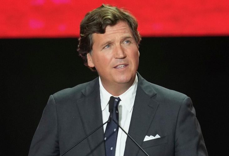 Trump defends Tucker Carlson after interview with activist known for his antisemitic views