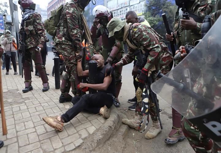 Police hurl tear gas at protesters in Kenya as Cabinet ministers are sworn in