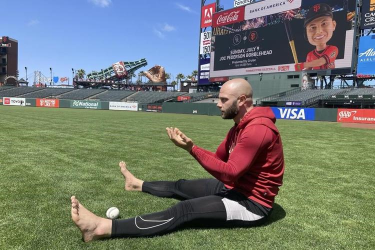 Baseball players are staying mindful on the diamond with barefoot walks in the grass
