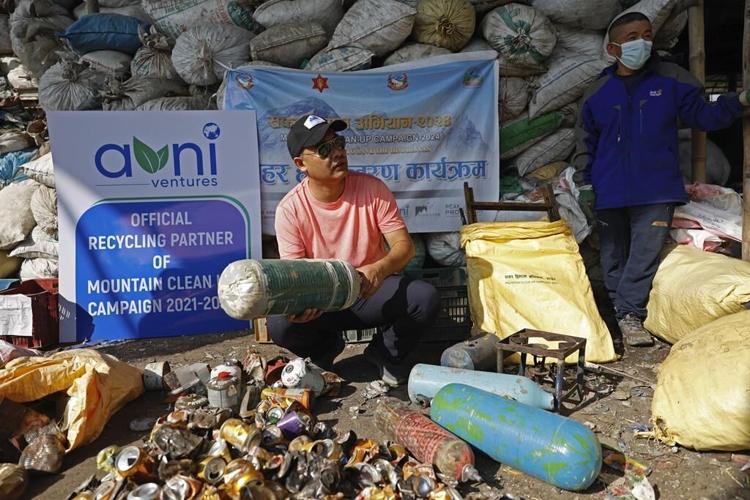 Mount Everest's highest camp is littered with frozen garbage, and cleanup is likely to take years