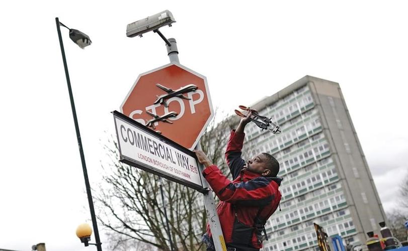 Suspect arrested in alleged theft of a Banksy stop sign decorated with military drones