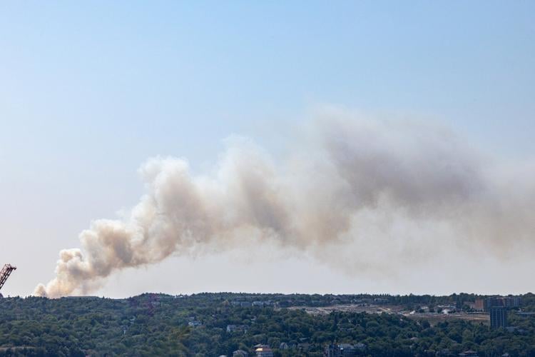 Firefighters attack Halifax wildfire burning at edge of city in foggy weather