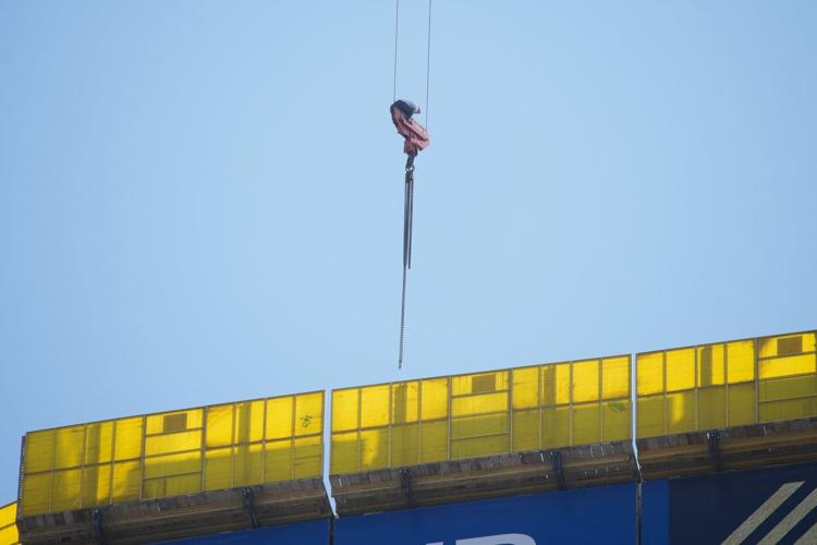 Fire teams rescue 15-year-old stuck on crane over high-rise building in Jerusalem