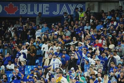 Toronto fans gather to cheer on the Blue Jays in wild-card opener