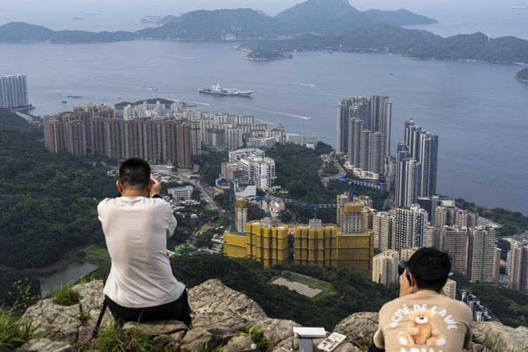 Chinese aircraft carrier sails into Hong Kong to boost patriotism