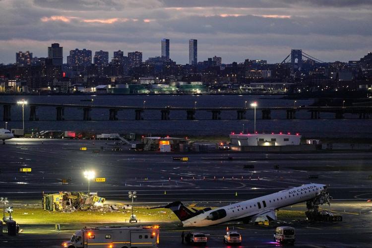 Photos show the scene of a collision on a runway at LaGuardia Airport in New York