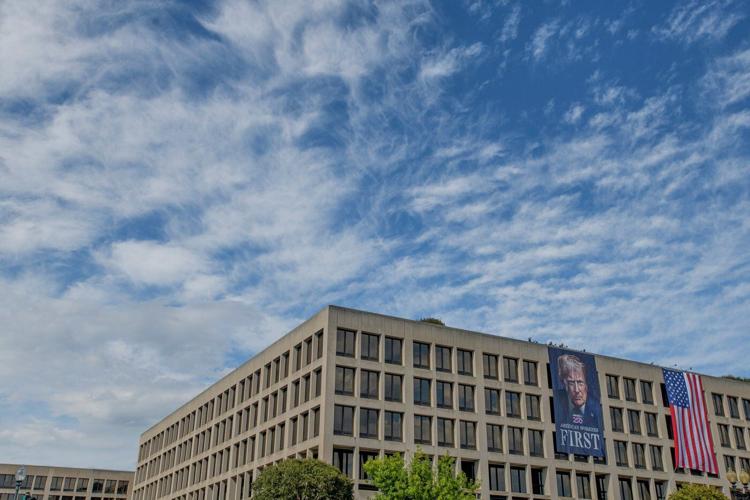 Photos of week three of Washington's federal takeover, as troops on patrol start carrying guns