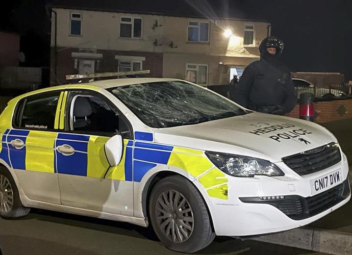 Cars set on fire in Cardiff as UK police face 'large scale disorder' after road crash