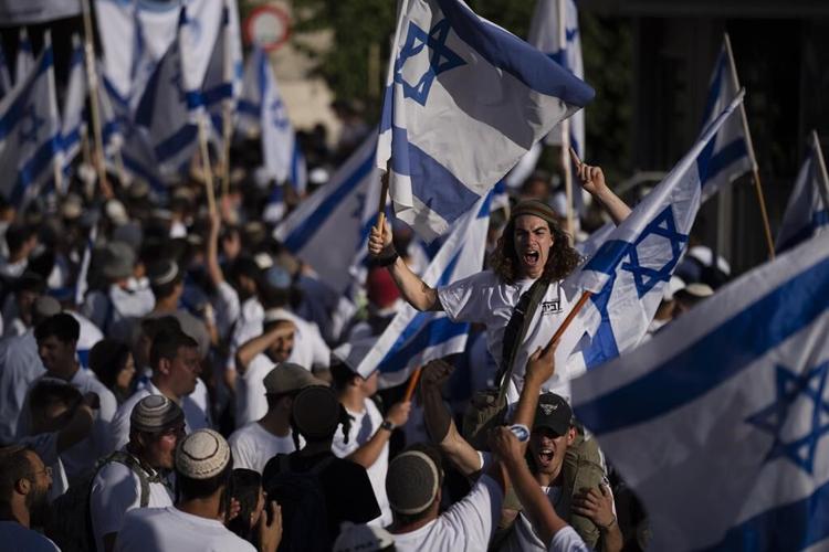 Israeli nationalists march in Jerusalem as a far-right minister boasts of Jewish prayer at key site