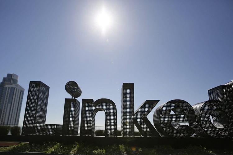 LinkedIn is rife with AI but career coaches say it's still useful for job hunters