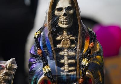 A leader of Mexican folk saint cult 'La Santa Muerte' is killed at an altar to the skeletal figure