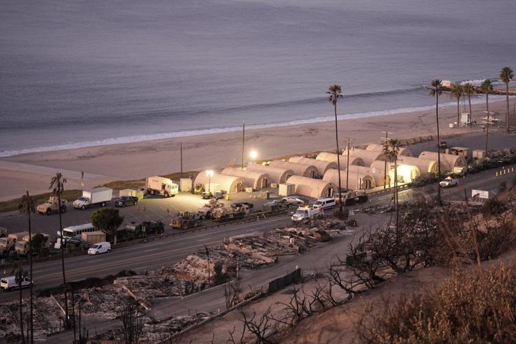 Ash and other dangers mean LA area residents who fled fires a week ago won't be going home soon