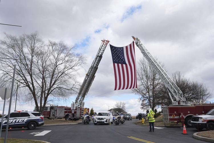 Prosecutor says officer killed in gunman's Pennsylvania hospital siege was hit by police fire