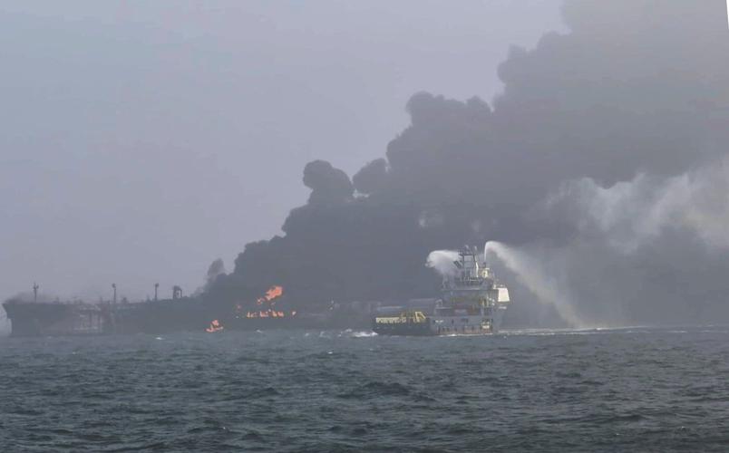 A cargo ship hits a tanker and they catch fire off England. The crew members are safe