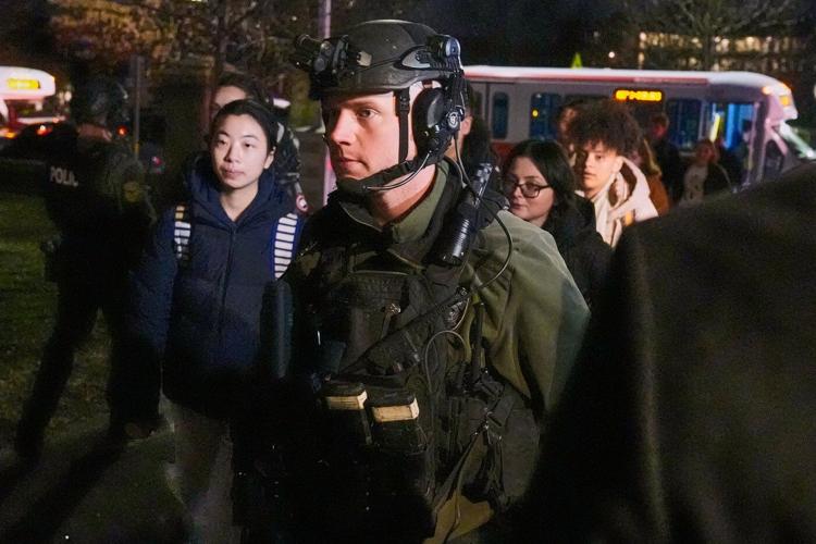 Photos show police investigation of a shooting at Brown University.